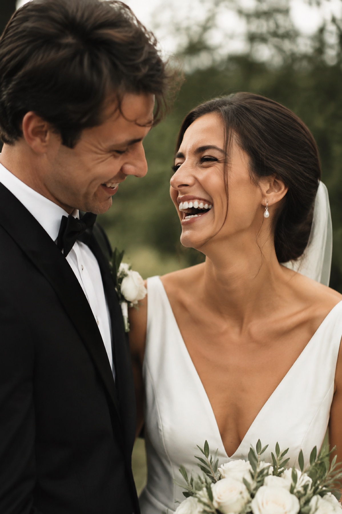 Joyful newlyweds viewing their private client gallery